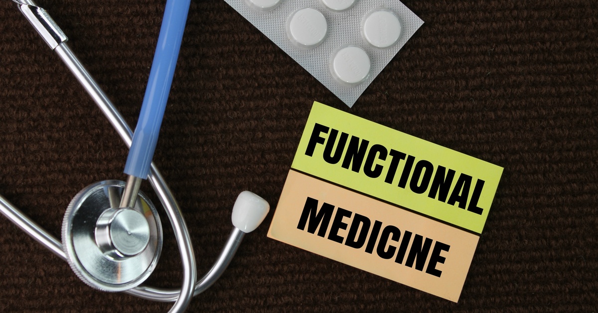 Yellow and orange blocks feature the words “Functional Medicine” in black letters. A stethoscope and medicine tablets are visible.